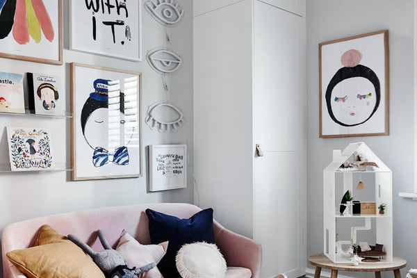 Cozy children's room with norsuHOME flooring, pink sofa, wall art, and wooden toys
