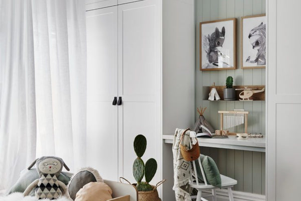 Cozy child's room with norsuHOME lighting, window furnishings, and playful decor elements