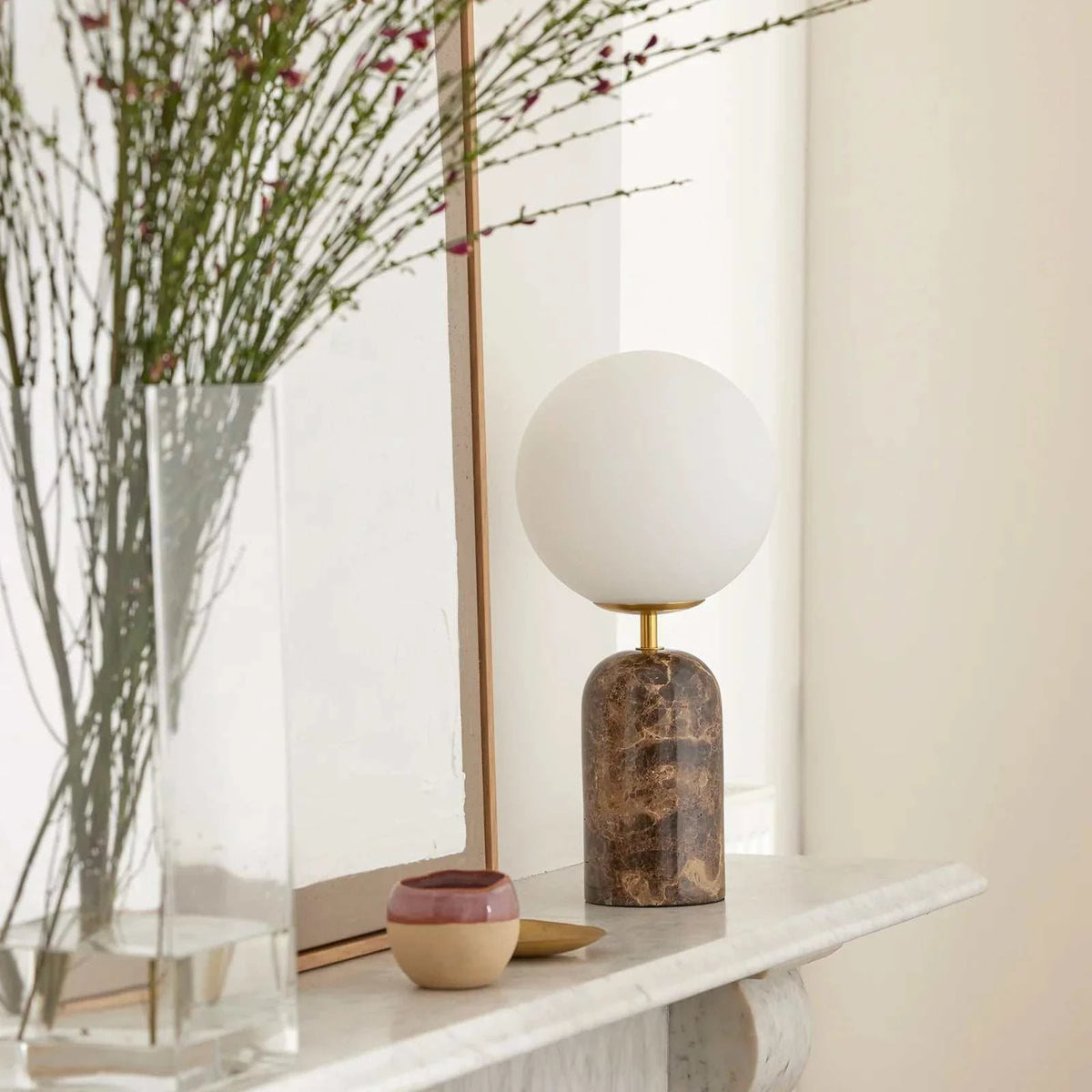 Soren Desk Lamp with brown marble base, brass accents, and frosted glass shade