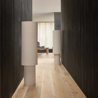 Sable Floor Lamp with linen double-cylinder shade emitting soft diffused light in minimalist design
