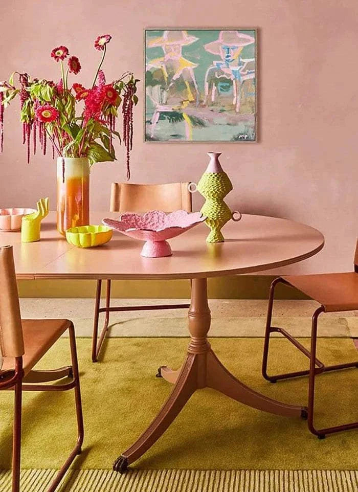 Marcia Priestley Limited Edition fine art canvas print "Stockman Yard" displayed in a modern dining room with pink walls, featuring acrylic and mixed media art and optional floating oak frame.