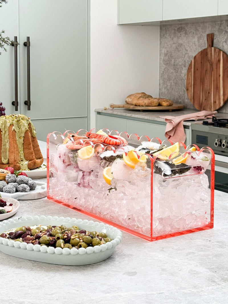 norsu Studio Perspex scalloped ochre drink bucket filled with ice and garnished with lemon wedges on kitchen counter