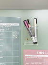 Blush A4 magnet meal planner on fridge with pink and black markers for weekly menu organization