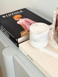 Stackable marble jewellery organiser canister on books with unique veining and compact design