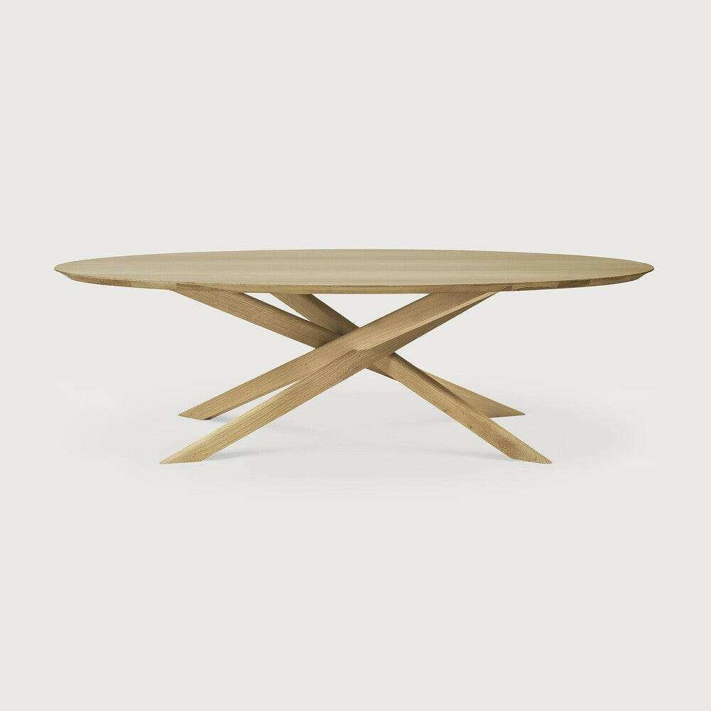 Ethnicraft Oak Mikado oval coffee table with solid oak top and crisscross base in natural finish