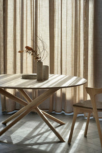 Ethnicraft Oak Mikado Round Dining Table, styled in a room setting