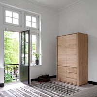 Ethnicraft Oak Shadow Dresser - 3 doors, 2 drawers, styled in a room setting