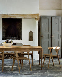 Ethnicraft Bok Extendable Dining Table - Teak, styled in a room setting