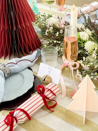norsu Studio customizable Christmas crackers with velvet ribbons on festive table setting