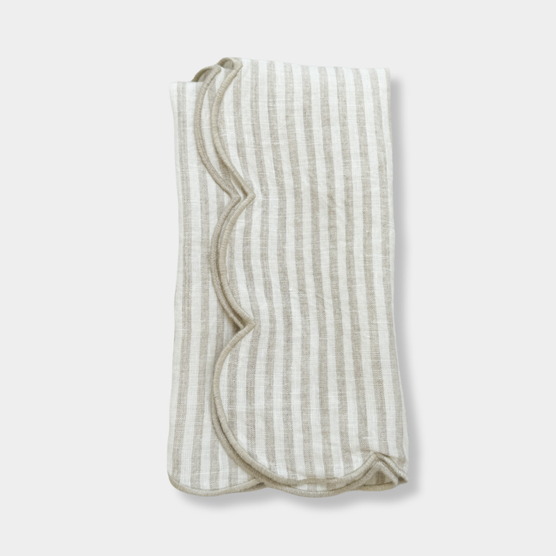 Set of 4 norsu Studio Linen Napkins in oatmeal stripe with scalloped edges and natural texture
