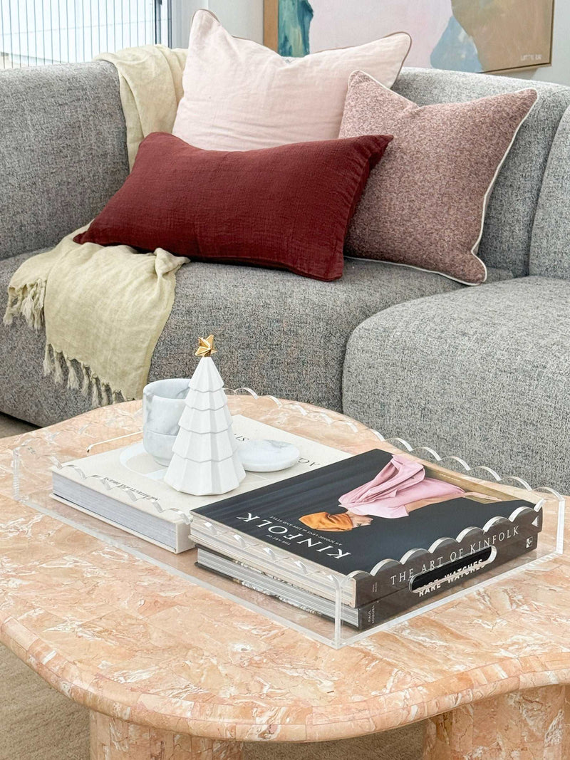 norsu Studio Scalloped Perspex clear tray on marble coffee table with decor items