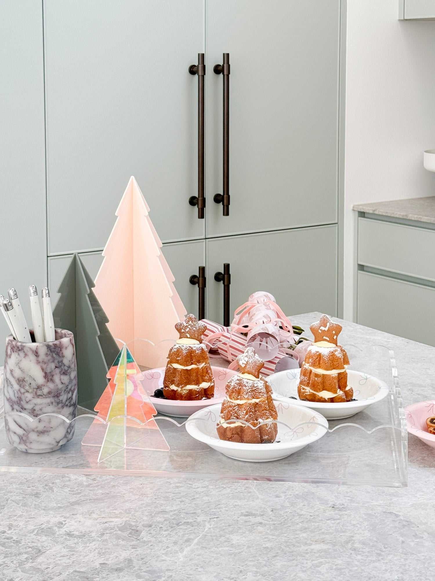 norsu Studio small white bowl with pink bow on kitchen counter with desserts and decorative items