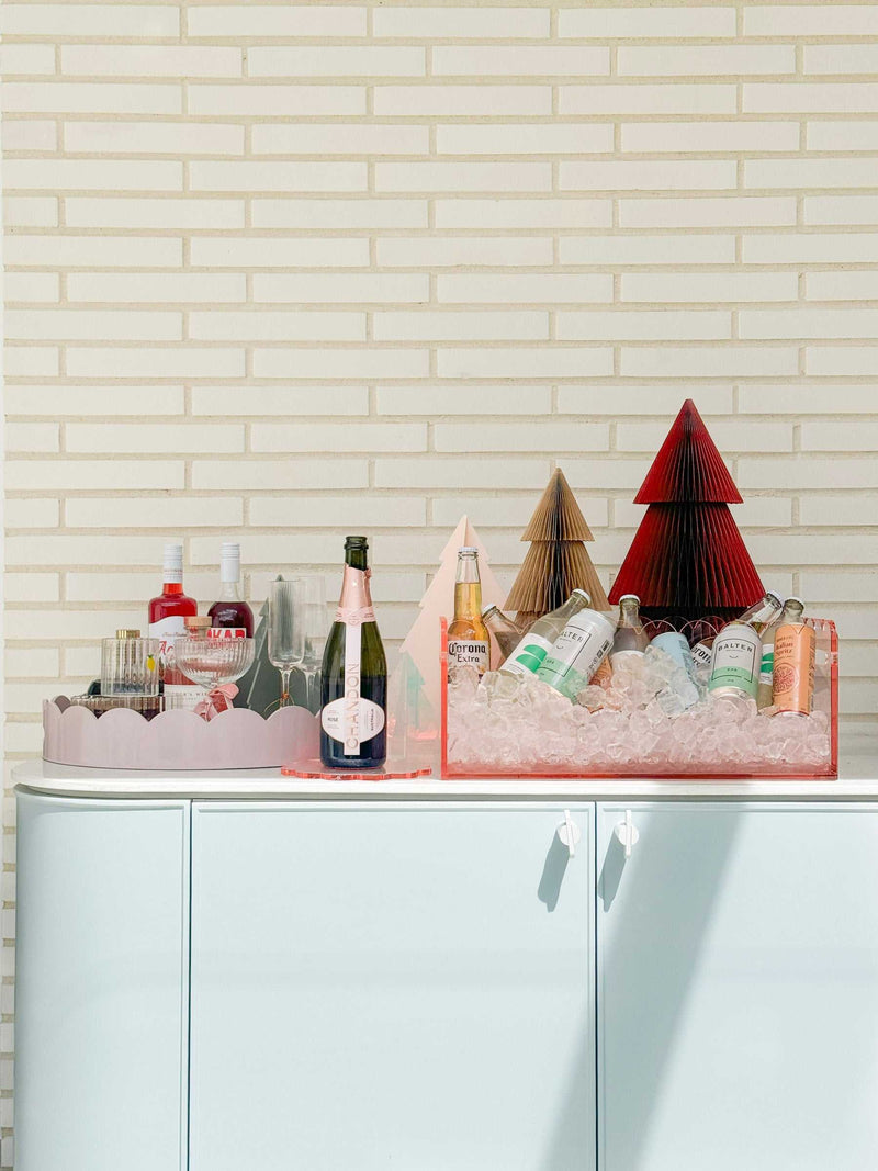 norsu Studio Round Scalloped Tray soft violet holding drinks with decorative items on white cabinet outdoors