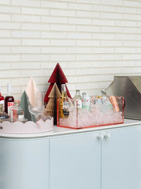 norsu Studio Round Scalloped Tray in soft violet lacquer finish styled on white cabinet with drinks and decor