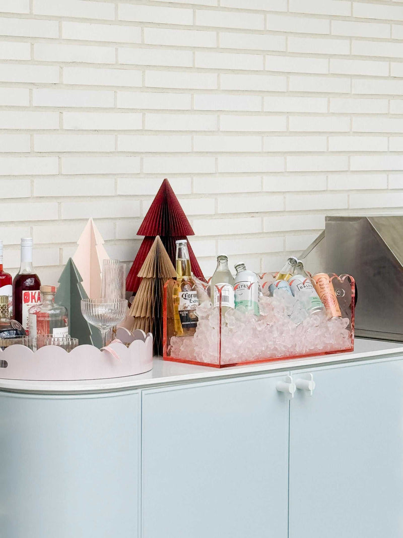 norsu Studio Round Scalloped Tray in soft violet lacquer finish styled on white cabinet with drinks and decor