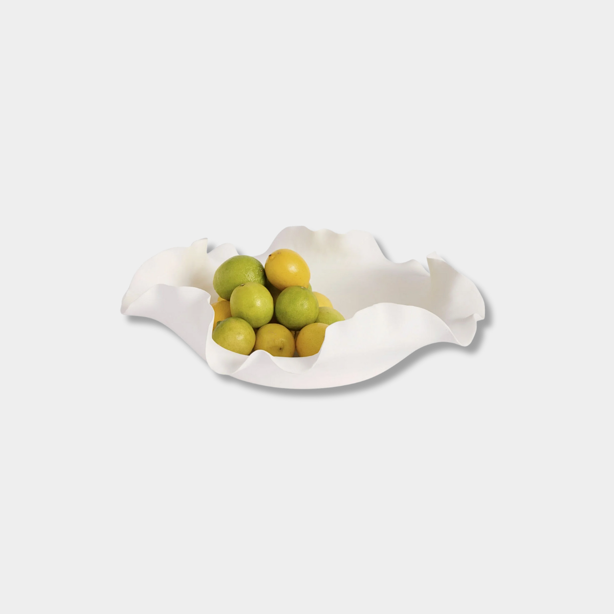 Nicole Decorative Bowl white ceramic with ruffled edges holding lemons and limes, 30cm diameter centerpiece