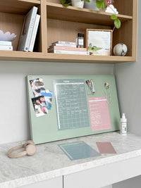 White liquid chalk marker displayed on a desk with a pastel-colored organizer board and stationery accessories