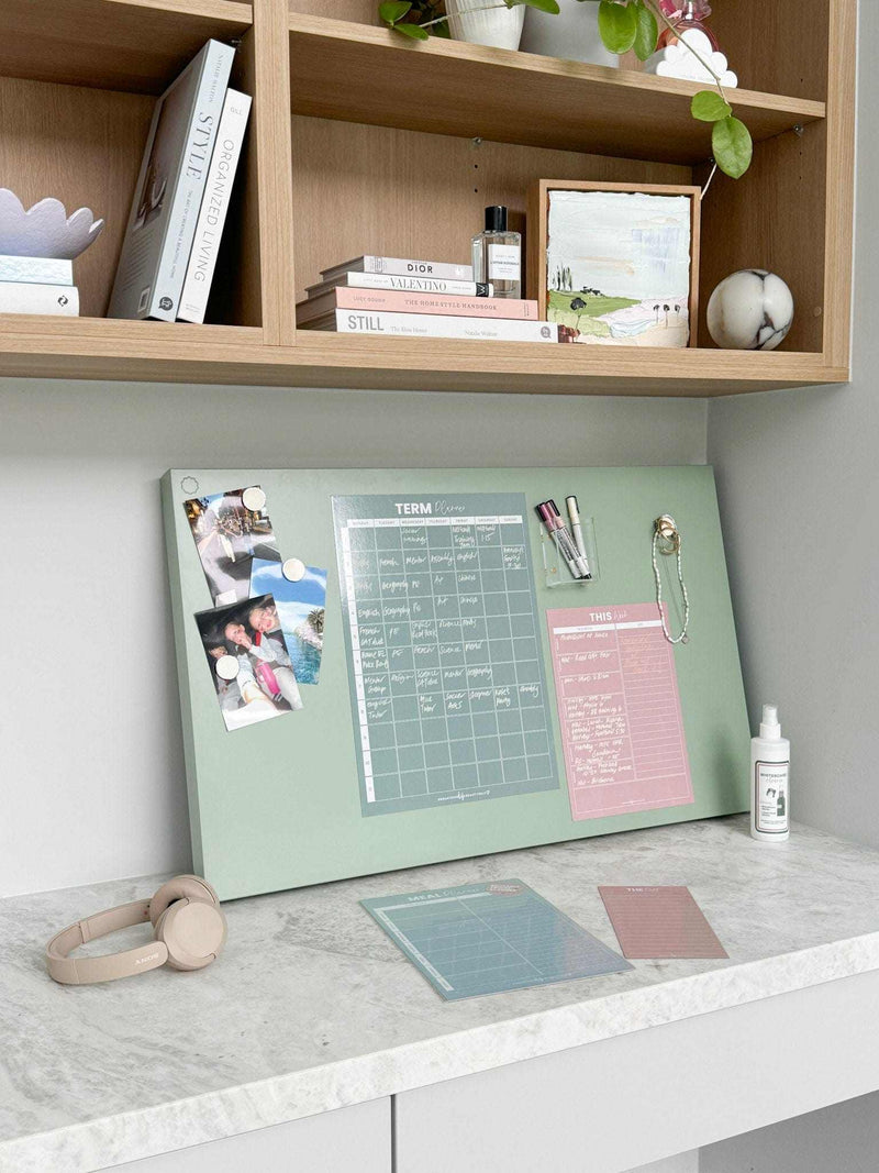 White liquid chalk marker displayed on a desk with a pastel-colored organizer board and stationery accessories