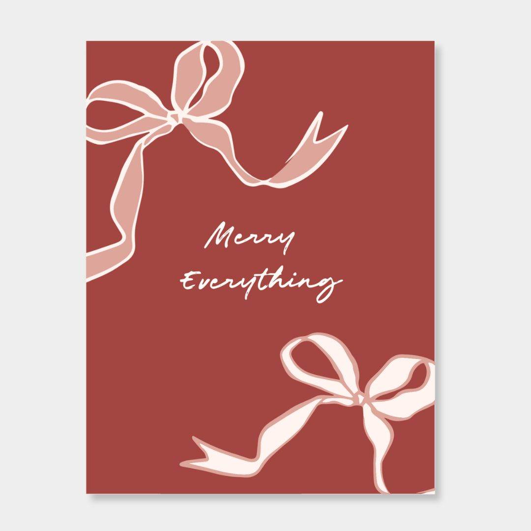 norsu STUDIO Christmas card with festive ribbon design and Merry Everything text on red background