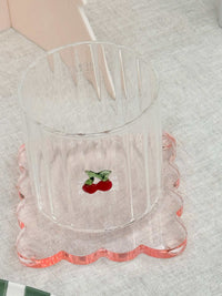 Set of four translucent ochre norsu Studio Perspex scallop coasters with signature scalloped edges