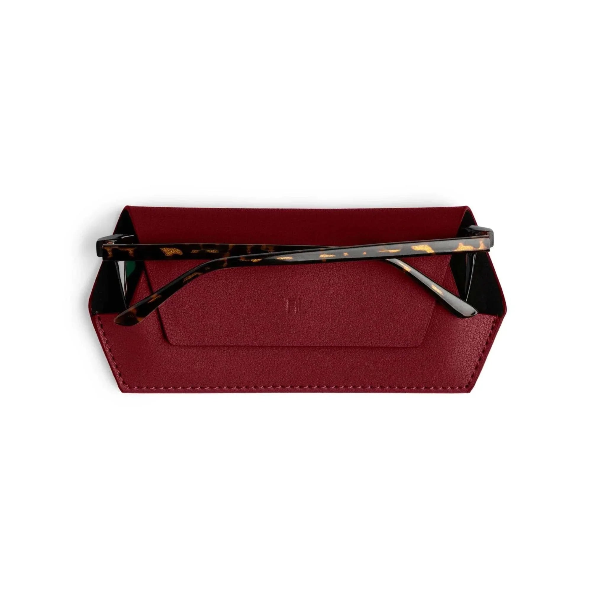 Burgundy Fox and Leo glasses case with magnetic backing and microfiber lining holding tortoiseshell frame glasses
