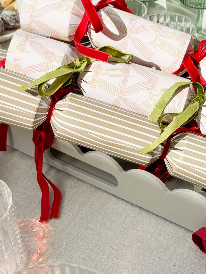 norsu STUDIO Rectangular Scalloped Tray in sage with hand-lacquered finish holding wrapped crackers