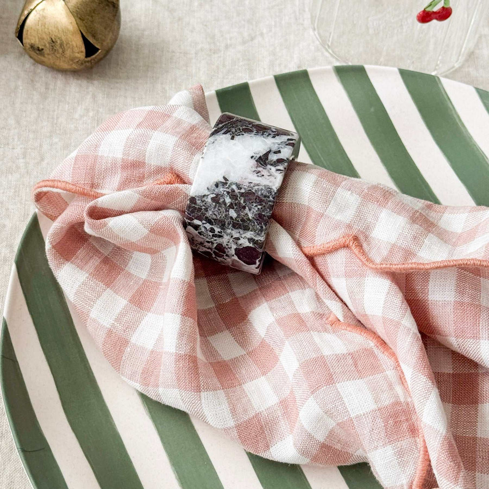 norsu Studio Linen blush gingham scallop-edged napkin set of 4 on striped plate with marble napkin ring