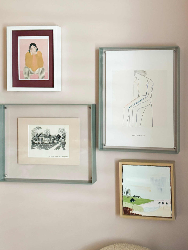 norsu STUDIO sage acrylic box gallery frame displaying art prints on wall, modern durable A3 photo frame with sandwich design and screw fasteners