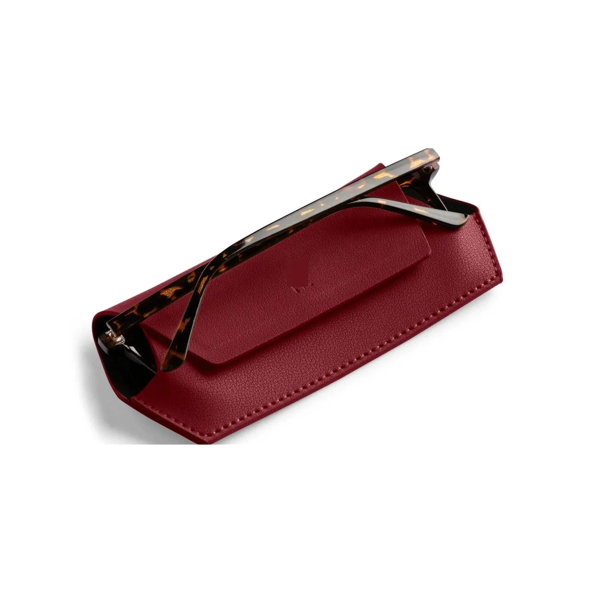 Burgundy Fox and Leo leather glasses case with magnetic closure and protective microfiber lining, slim design shown with tortoiseshell glasses.