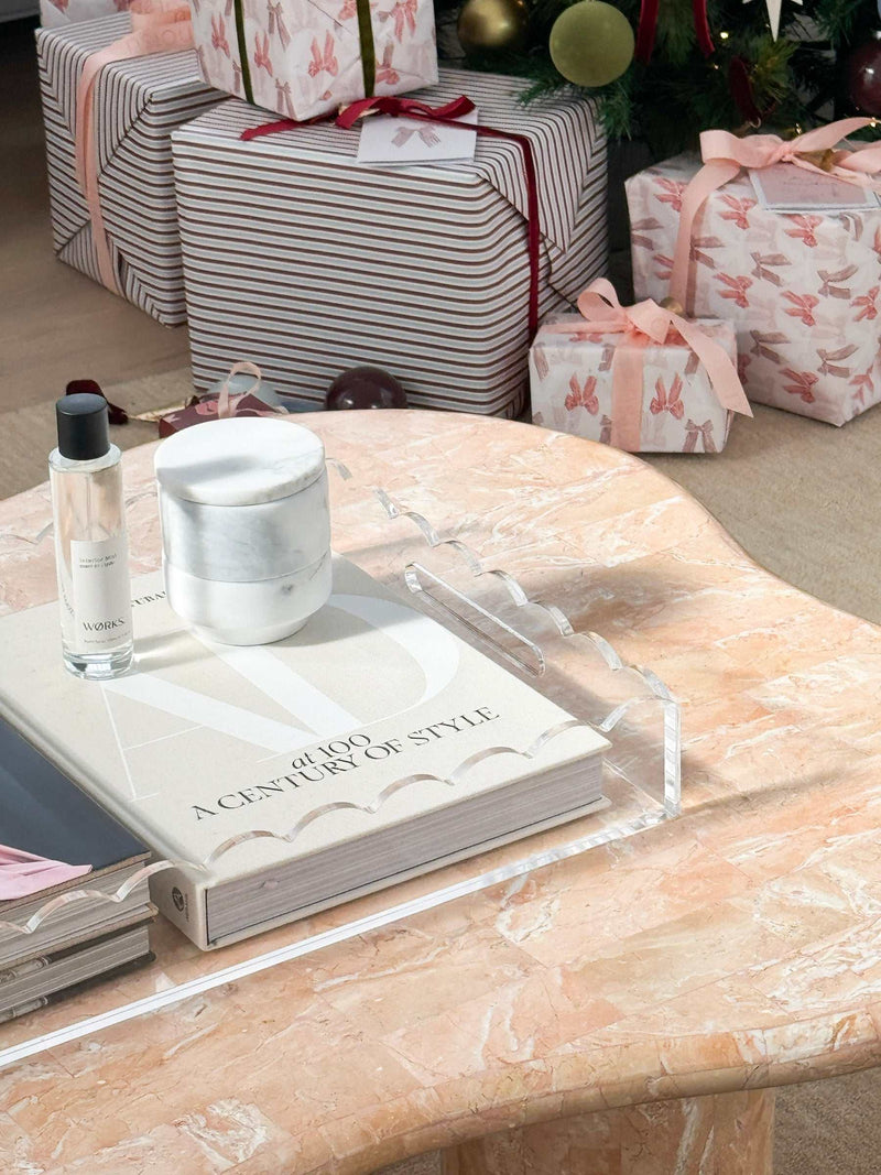 norsu Studio scalloped edge clear Perspex tray on marble table with books and decor items