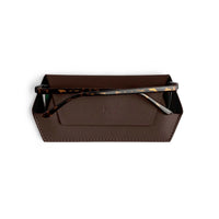 Fox and Leo glasses case in chocolate brown leather with slim protective microfiber lining and magnetic closure holding tortoiseshell eyeglasses.