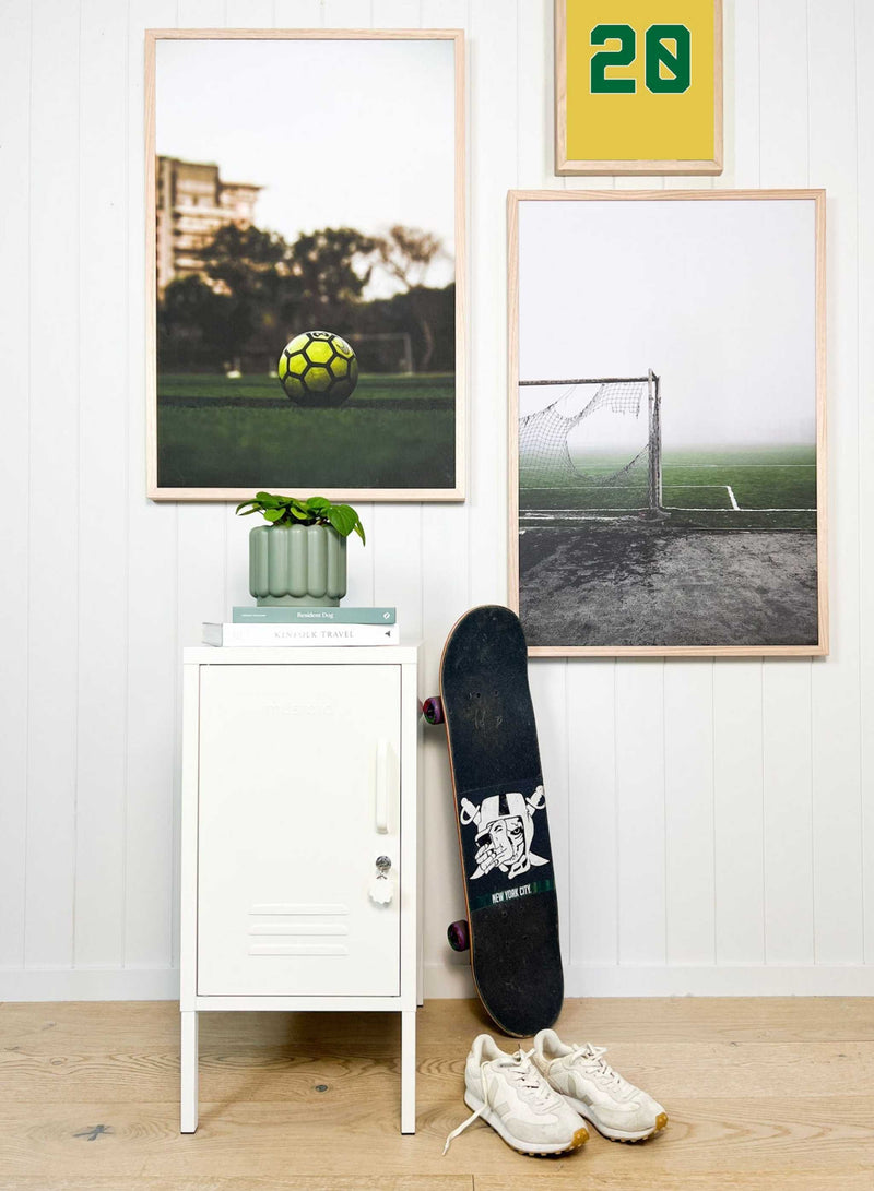 Customizable sports-themed wall art prints with personalized number and color options displayed in a modern room setting