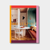 Book cover of Arent & Pyke Interiors Beyond the Primary Palette featuring a colorful modern interior with coral, olive, and nougat tones and a round dining table with chairs.