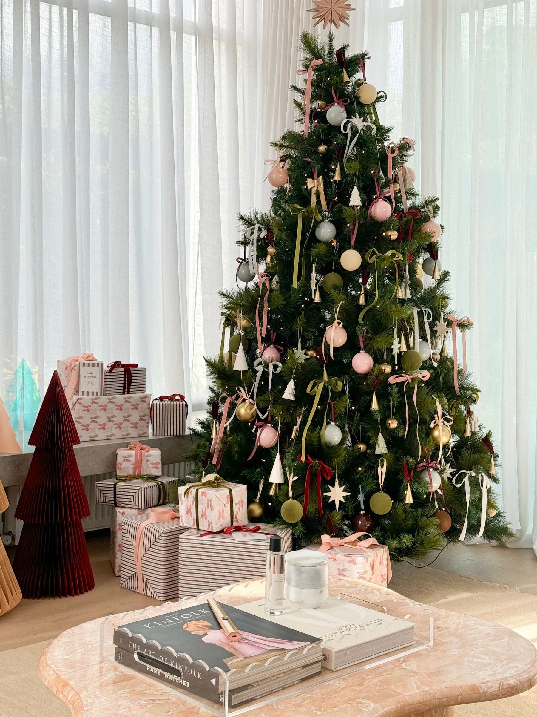 norsu Studio Christmas Wrapping Paper wrapped gifts under decorated Christmas tree in stylish living room