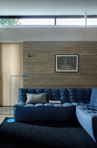 Ethnicraft Sofa N701 Round Corner - Blue, styled in a room setting
