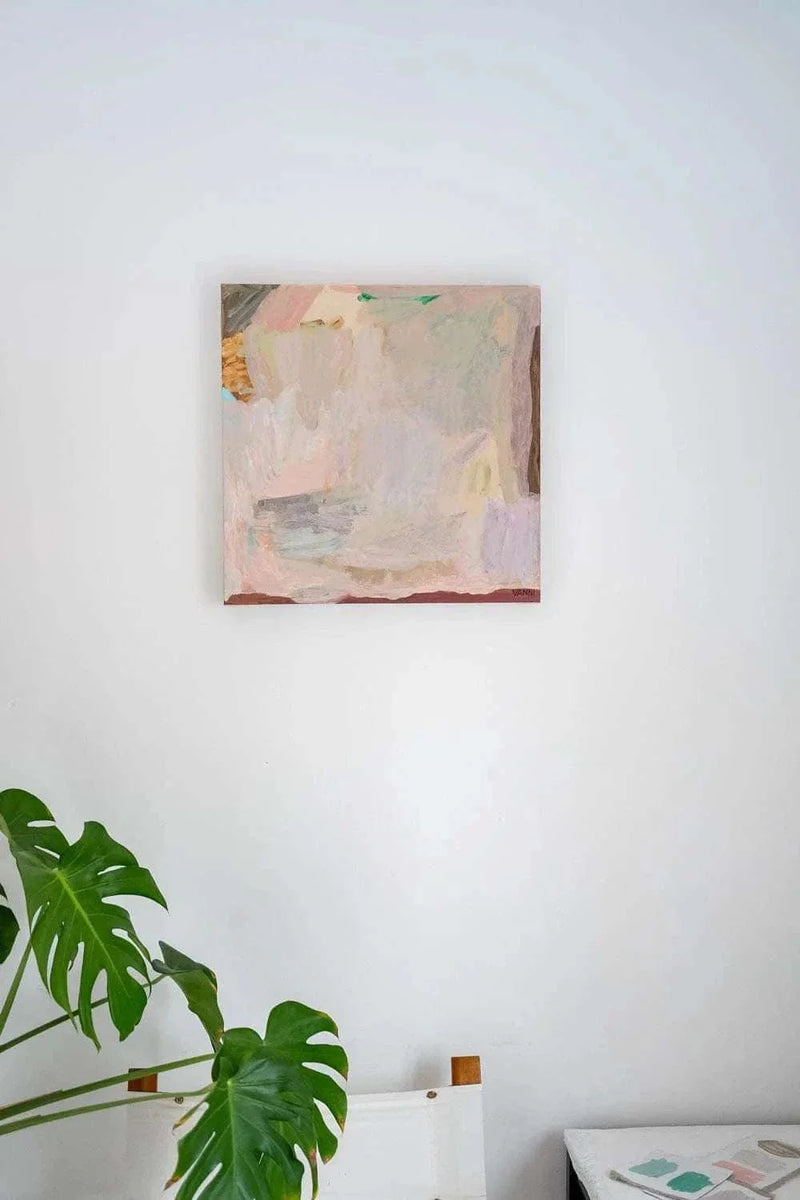 Abstract pastel-colored limited edition canvas art print titled Endless Summer by Vanni displayed on a white wall above a chair and near a green plant