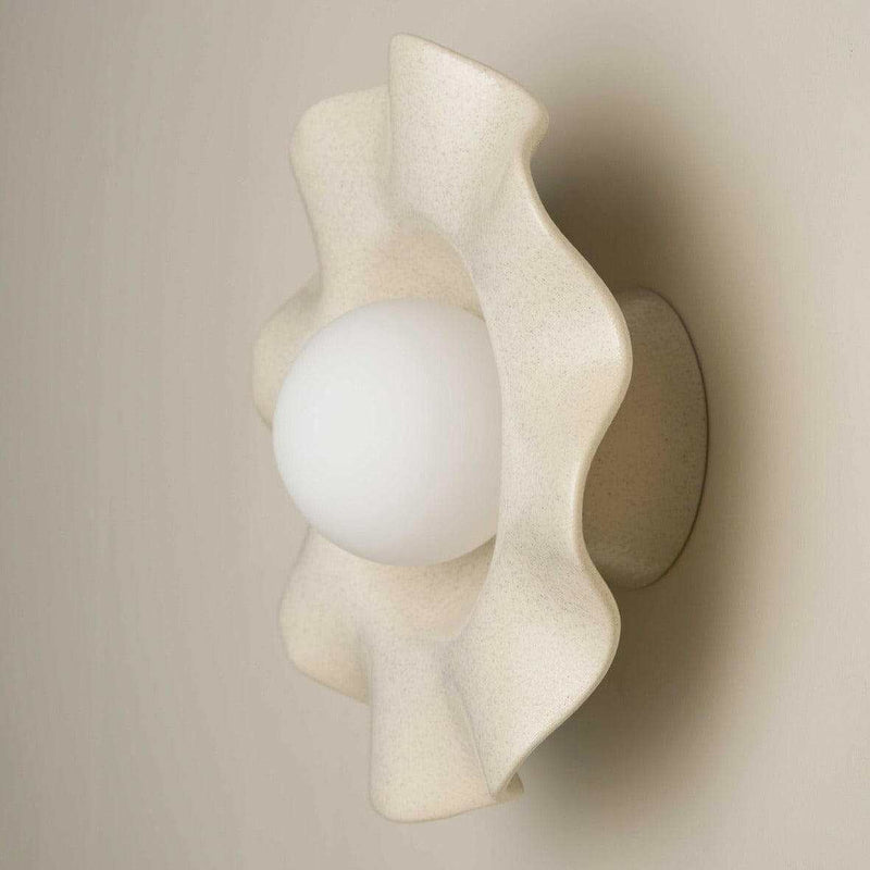 Robert Gordon Pearl Wall sconce ceramic light with ruffled design in poppyseed color and frosted globe