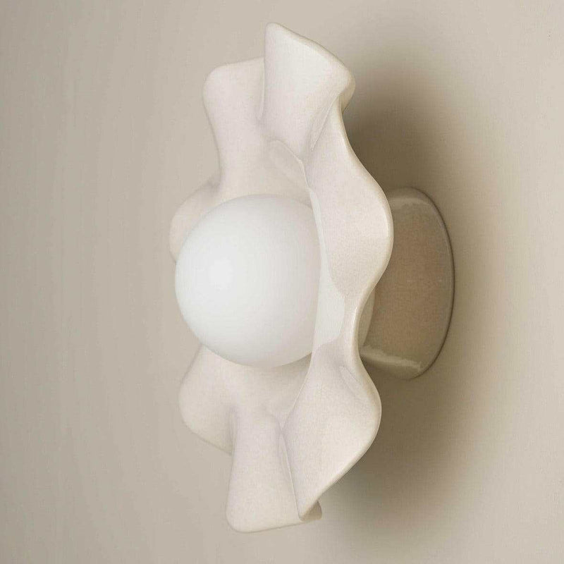 Robert Gordon Pearl Wall Sconce in white clay with ruffled ceramic design and round globe light