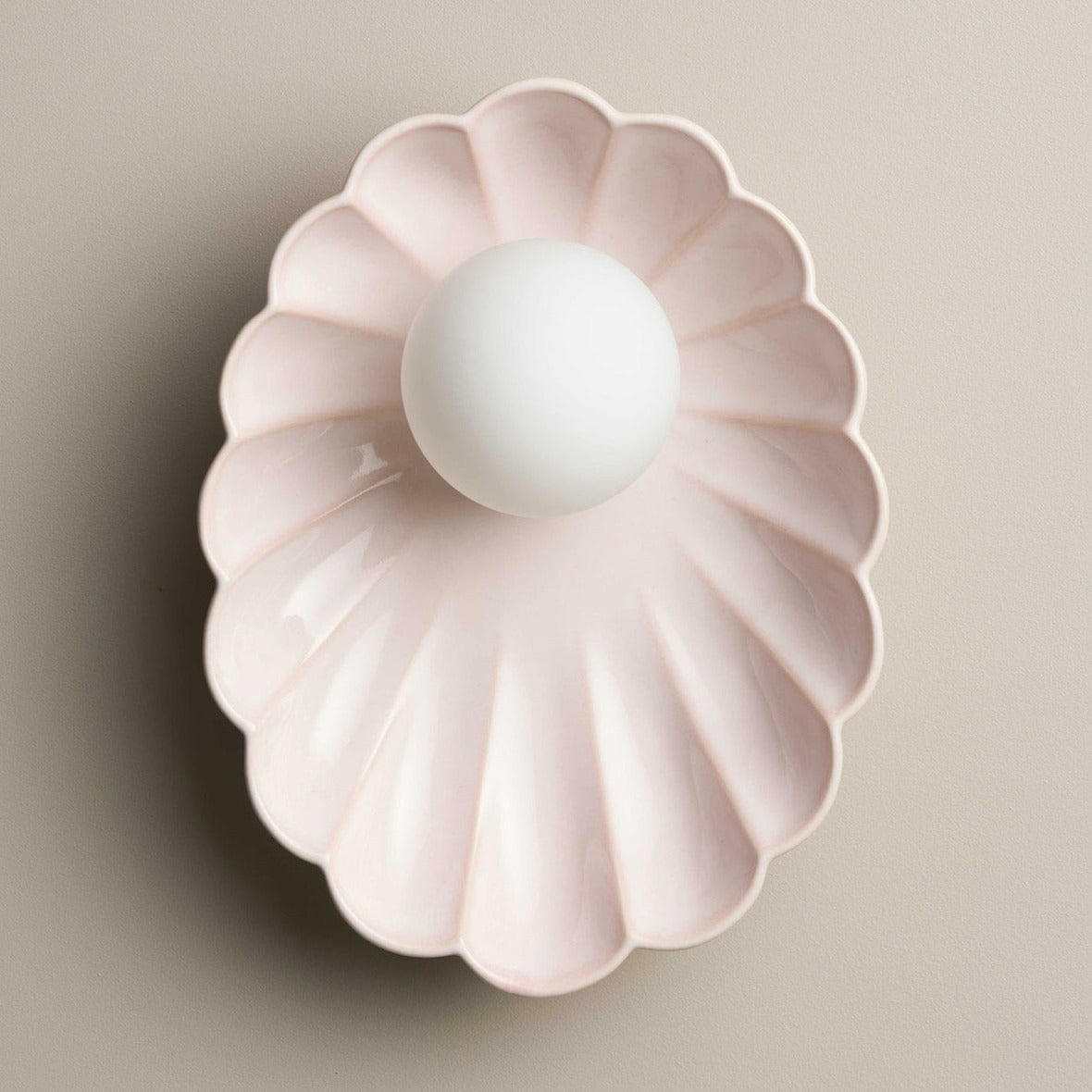 Robert Gordon Oyster Ceramic Sconce Light in rose quartz with scalloped design and round bulb