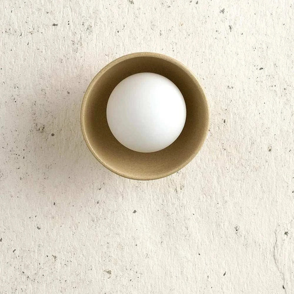 Robert Gordon Bowl sconce light, sand | Norsu Interiors