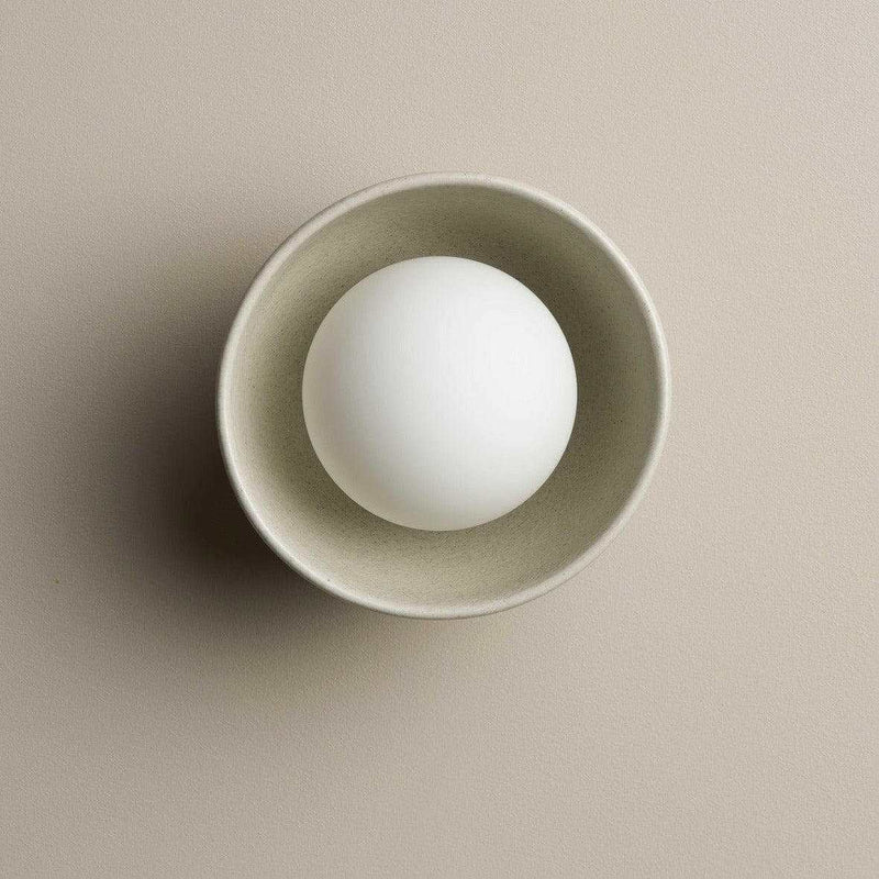 Robert Gordon Bowl Ceramic sconce light in shale with halogen globe and wall fixture, handmade compact design.