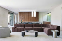 GlobeWest Oberon Curve Marble Coffee Table - Matt Ocean Marble, Natural Ash, styled in a room setting