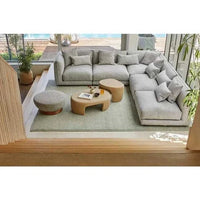 GlobeWest Bower Frame Rug in seafoam color, hand-woven wool area rug in modern living room setting