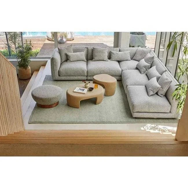 GlobeWest Bower Frame Rug in seafoam color, hand-woven wool area rug in modern living room setting