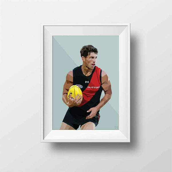 Framed DG Designs Dom Gauci kids art print of Archie Perkins in Essendon Football Club AFL uniform holding yellow football on sage green background