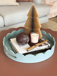 norsu Studio Round Scalloped Tray in duck egg blue with scalloped edges and glossy finish on table decor