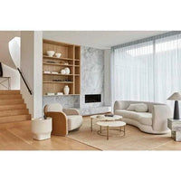 GlobeWest Hugo Vera 4 seater oat boucle sofa in modern living room with marble fireplace and wooden shelving