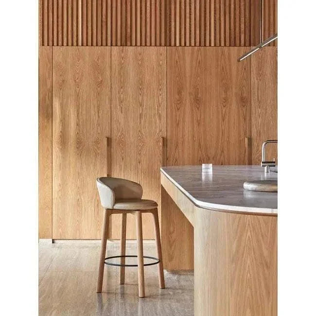 GlobeWest Rufus Indra Bowl in oat marble on kitchen countertop with wooden cabinetry background