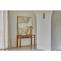 Hand-painted Sand Collection Wall Art in warm red, rust, yellow, and pink tones on Indian cotton canvas with Victorian Ash timber frame in a modern interior setting