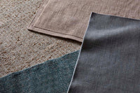 GlobeWest Tepih Neptune Rug - Midnight, styled in a room setting